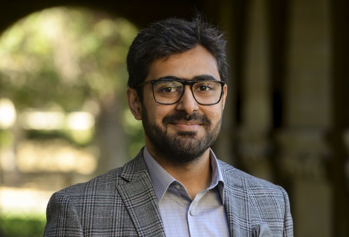 man with glasses smiling