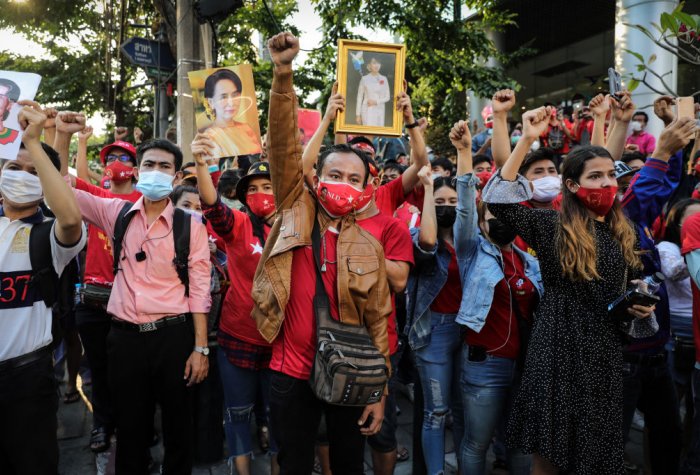 People holding up images in protest