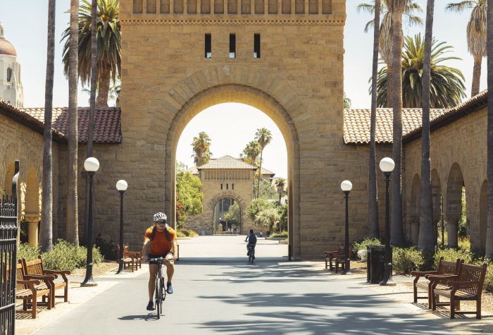 Student riding bicycle on Stanford University campus