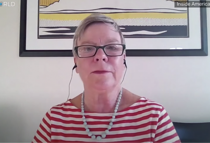 Women in glasses and a striped red shirt