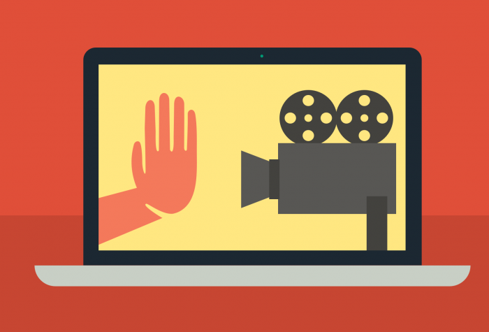 stop hand facing video camera