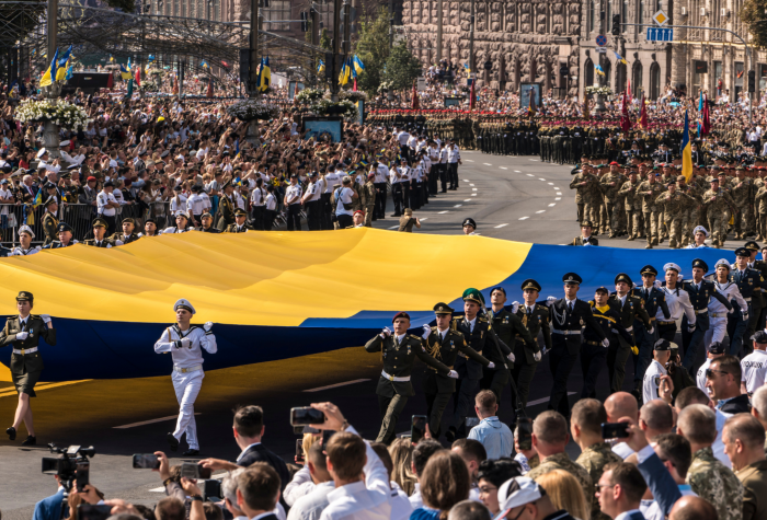 Members of the Ukrainian military carry the flag of Ukraine during the 30th anniversary of the country's independence.