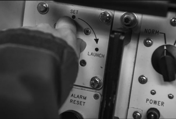 A US Air Force commander simulates launching a nuclear weapon during a test.