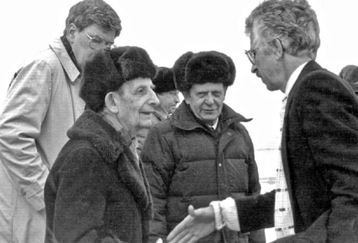 A group of people around each other