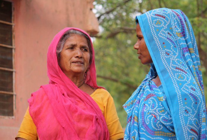 Two women standing in a street in Rajasthan, India