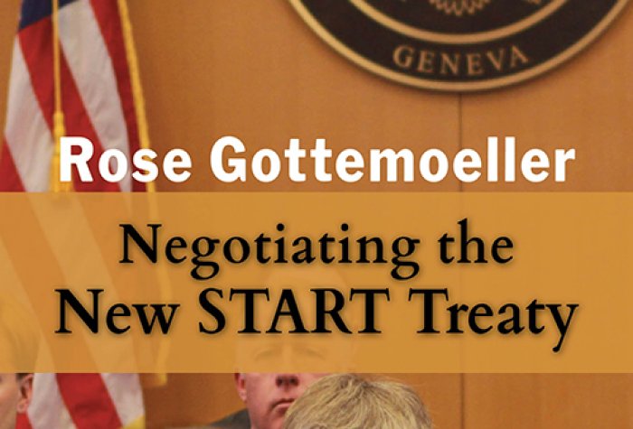 Image of Rose Gottemoeller sitting in front of the U.S. flag
