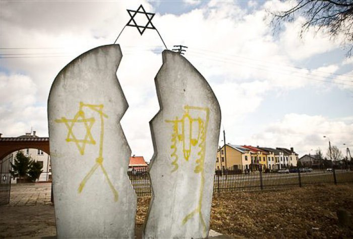 Memorial plaque stained with anti-Semitic vandalism in Mazowieckie, Poland, March 19, 2012. Memorial plaque stained with anti-Semitic vandalism in Mazowieckie, Poland, March 19, 2012.