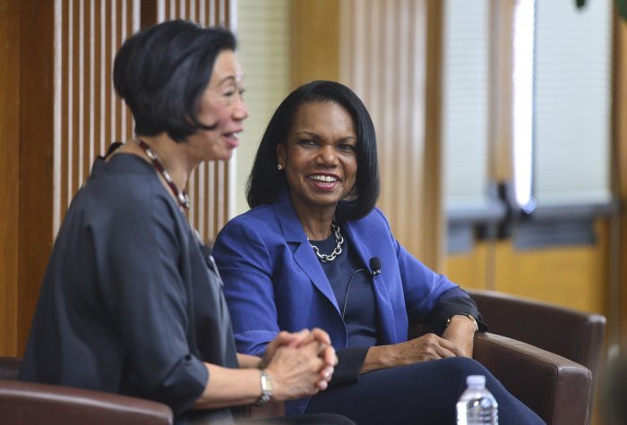 Jean Oi speakin as Codoleezza Rice listens on