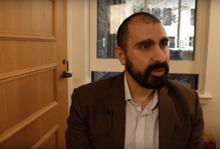 Andray Abrahamian sitting down for an interview at Stanford.