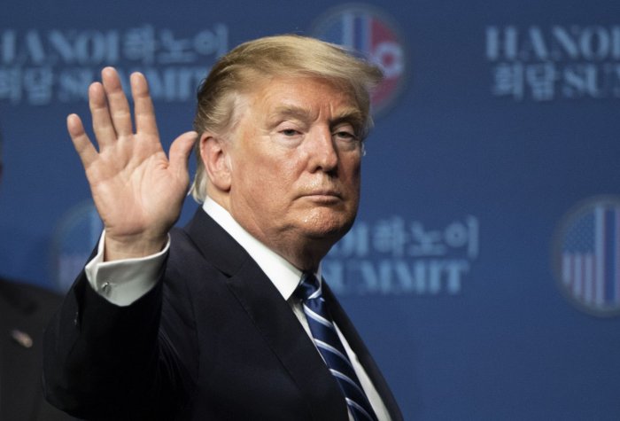 President Trump waves to camera at Hanoi Summit