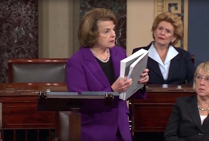 U.S. Senate Intelligence Committee Chairman Dianne Feinstein holds a copy of a summary report on the CIA's detention and interrogation program on the day of its public release – December 9, 2014. dianne feinstein senate cia report 12 09 14