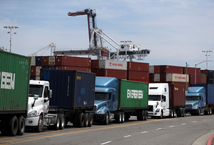 Trucks line up to enter a shipping berth at the Port of Oakland