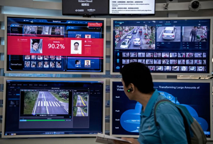 A display for facial recognition and artificial intelligence is seen on monitors at Huawei's Bantian campus on April 26, 2019 in Shenzhen, China.