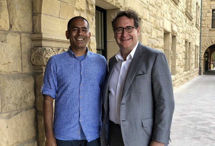 Prasanna Jagannathan (left) is the 2018 winner of the Rosenkranz Prize, which will allow him to work on developing a malaria vaccine for pregnant women. He is with Ricardo T. Rosekranz, son of Dr. George Rosenkranz, whose family endowed the prize in 2009.