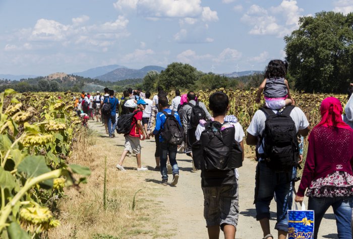 immigrants at the border between Greece and Macedonia. Shutterstock photo of immigrants at the border between Greece and Macedonia.