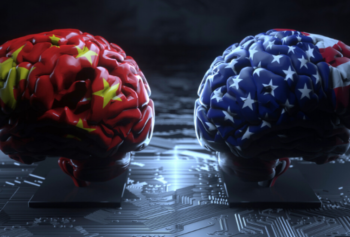 Concept of U,S.-China technology competition: brain-shaped boxing gloves covered in U.S. and China flags facing against each other on a background of a motherboard