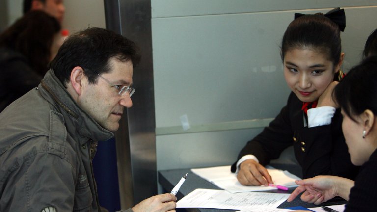 A foreign job seeker talks with two Chinese employers during a job fair for foreigners at the Beijing Talent Tower in March 2008 in Beijing, China. A foreign job seeker talks with two Chinese employers during a job fair for foreigners at the Beijing Talent Tower in March 2008 in Beijing, China.