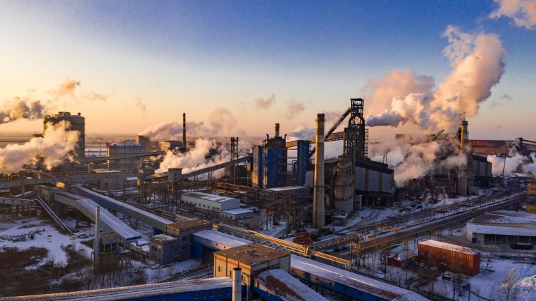 Landscape of industrial area sunset in winter with smog clouds.