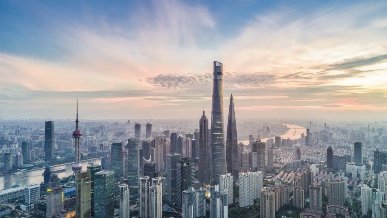 Aerial view of Shanghai, China financial district with sunrise.