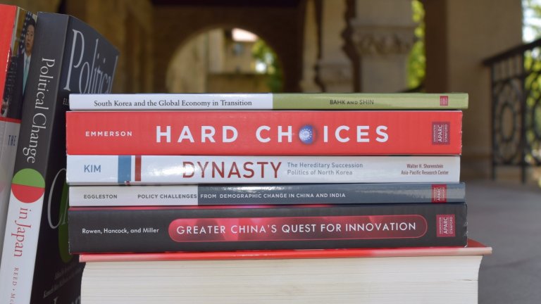 A collection of books published in Shorenstein APARC in-house monograph series set against the background of Encina Hall entranceway A collection of books published in Shorenstein APARC in-house monograph series set against the background of Encina Hall entranceway