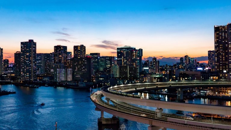 Rainbow bridge and skyline at dusk, Tokyo, Japan.